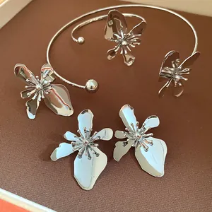 Macro view of high-end vintage silver metal flower necklace and earrings jewelry set