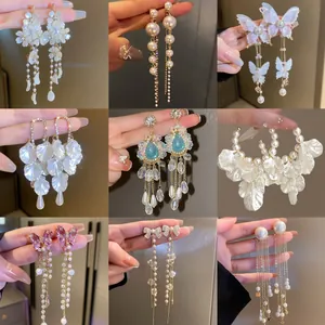 Collection of elegant tassel earrings with pearls and floral butterfly designs