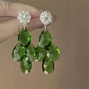 Retro vintage style green drop earrings with crystal floral studs and faceted teardrops