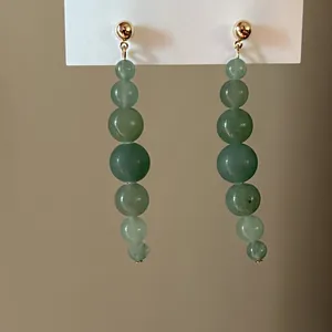 Elegant vintage green jade bead dangle earrings with gold ball studs macro detail