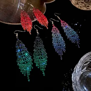 Sparkling rhinestone feather tassel earrings in vibrant gradient colors