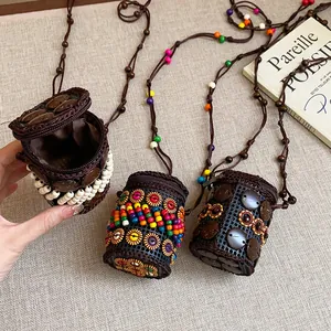 Macro view of Bohemian coconut shell pouch necklaces featuring colorful beads and textures.