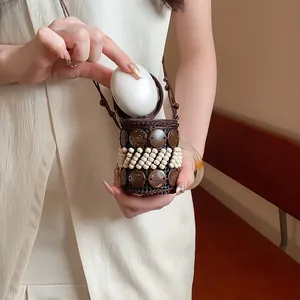 Bohemian ethnic coconut shell necklace used as a small storage pouch for earphones
