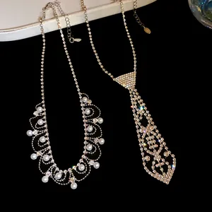 Detailed close-up showing the shimmering rhinestone tie necklace and pearl fringe design