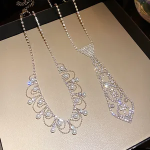 Macro view of luxurious rhinestone tie necklace and elegant pearl fringe jewelry detail