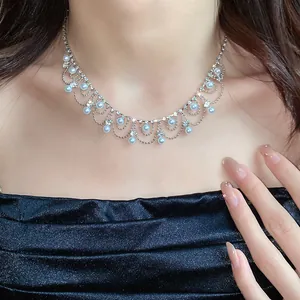 Detailed macro shot of an elegant pearl and rhinestone fringe choker necklace on a model neck