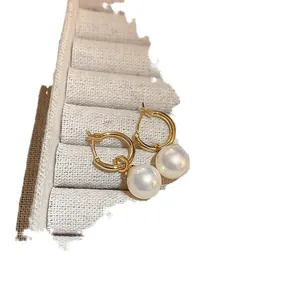 Elegant French style gold plated hoop earrings with large round white pearls for women.