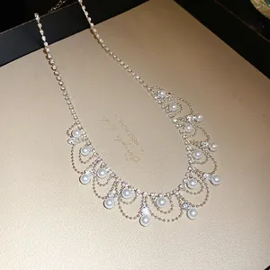 Detailed view of French vintage necklace with pearls and sparkling rhinestones