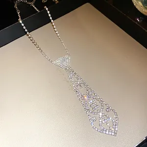 Close-up of an elegant rhinestone tie necklace featuring vintage French style details.