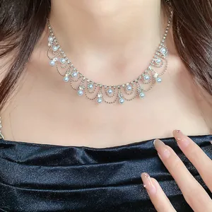 Elegant French vintage choker necklace with white pearls and sparkling rhinestones on model