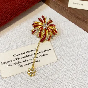 Exquisite red enamel firework flower brooch with sparkling rhinestones and gold dangles
