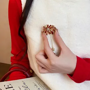 Elegant rhinestone firework flower brooch for women, refined luxury jewelry accessory.