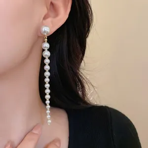 Elegant French retro long pearl tassel earrings with silver needles for stylish women