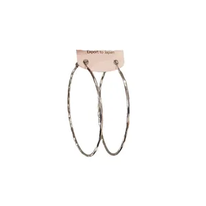Large silver textured metal hoop earrings with a twisted design on a white background