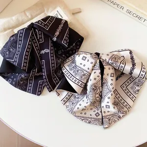 Vintage paisley pattern bow hair claw clips for elegant women's half-up hairstyles