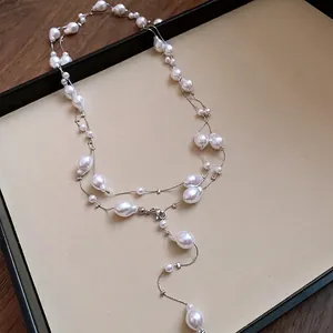Elegant French style triple-layer necklace featuring irregular baroque pearls on silver chain