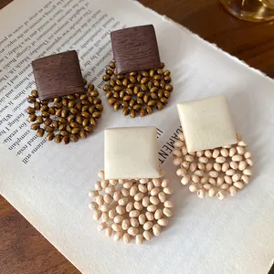 Detailed view of Bohemian square beaded drop earrings with vintage wood textures