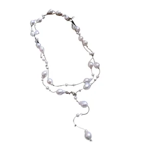 Elegant French style three-layer necklace featuring irregular pearls on a fine silver chain