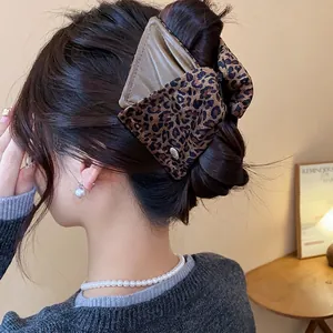 Large leopard print hair claw clip with triangle leather accent in Maillard style