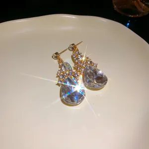 Close-up of elegant waterdrop crystal drop earrings with sparkling rhinestones