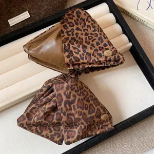 Large triangular leopard print hair claw clip in elegant Maillard brown for women