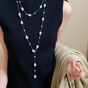 Close-up of a French style layered necklace featuring irregular baroque pearls
