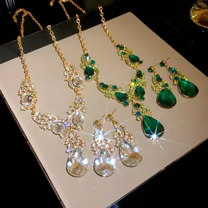 Detailed view of sparkling rhinestone waterdrop pendant necklace and earring sets