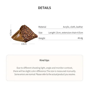 Detail view of large leopard print triangular hair claw clip with size and material info