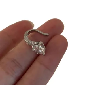 Minimalist silver-colored round cubic zirconia ear cuff for non-pierced ears, elegant style