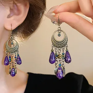 Orecchini a goccia viola etnici vintage con eleganti motivi circolari tribali