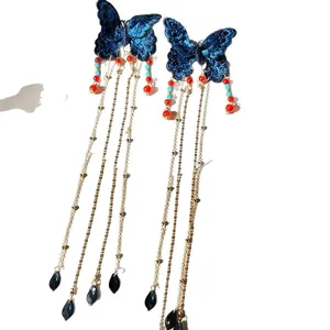 Élégantes pinces à cheveux papillon bleu brodé avec longs glands dorés et perles