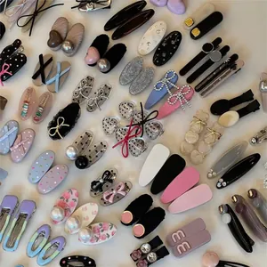 Collection of Korean style hair clips with bows, pearls and dots on a white background