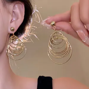 Elegant vintage multi-layer geometric gold hoop earrings featuring high-quality steel needle posts