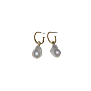 Elegant irregular baroque pearl gold hook earrings with a French niche design style