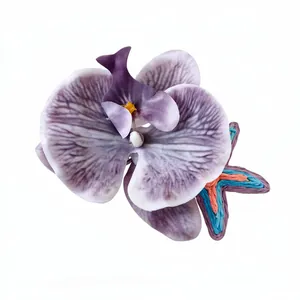 Elegant purple fabric orchid flower hair clip with woven starfish detail for vacation