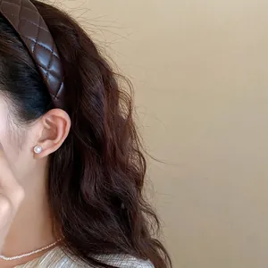 Elegant retro quilted brown leather headband for women providing a stylish high top look