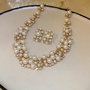 Vintage French palace pearl and rhinestone jewelry set with necklace and earrings