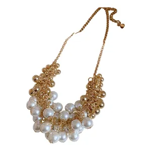 Elegant French vintage necklace with white pearls and gold bead fringe detailing