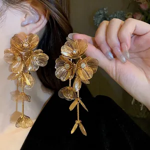 Exaggerated gold flower tassel earrings with sparkling rhinestones for women