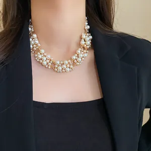 Elegant French retro pearl and rhinestone chunky choker necklace worn by a model