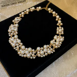 Close-up detail of a vintage French-style pearl and rhinestone choker necklace