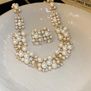 Detail shot of elegant pearl and rhinestone necklace set in vintage French royal style