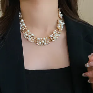 Exquisite detailed view of French vintage pearl and rhinestone choker on model