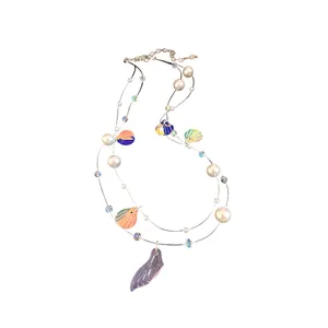 Double-layered pearl necklace featuring colorful shell sequins and fish tail pendant