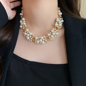 Elegant French retro pearl and rhinestone choker necklace for women worn by a model