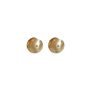 Brushed gold round stud earrings with star rhinestone inlays and silver needles.