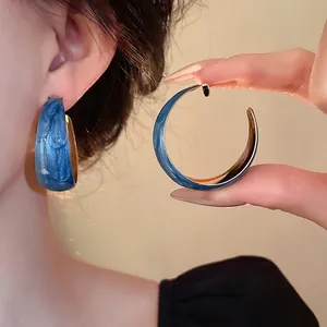 Klein blue marbled hoop earrings with gold lining and silver needles for women