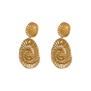 Elegant golden oval textured drop earrings with a spiral shell pattern for stylish women