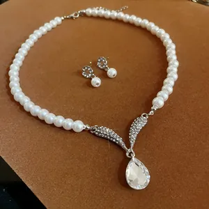 Elegant bridal jewelry set with pearl necklace and rhinestone teardrop crystal pendant