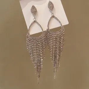 Elegant silver-tone rhinestone waterdrop tassel earrings for a luxury vintage look.